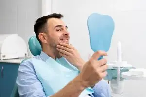 Имплантация передних верхних зубов